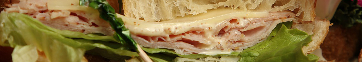 Eating Sandwich Cafe at Euro Market & Cafe restaurant in Arlington, VA.